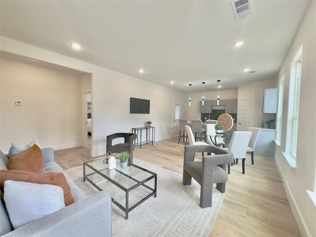3801 Carpenter Ave, Dallas, TX 75210 - living room with light wood-style floors, recessed lighting, and baseboards