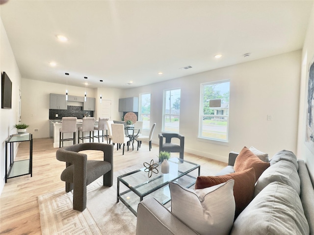 3801 Carpenter Ave, Dallas, TX 75210 - living room featuring recessed lighting, light wood-style flooring, and baseboards