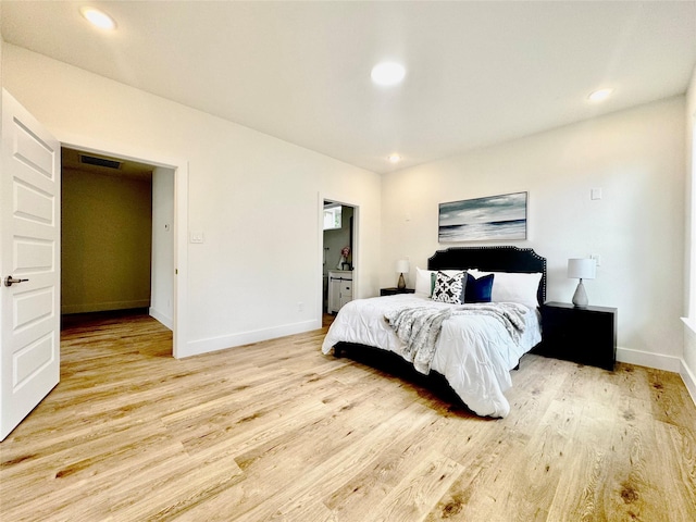 3801 Carpenter Ave, Dallas, TX 75210 - bedroom with light wood-type flooring, baseboards, and recessed lighting