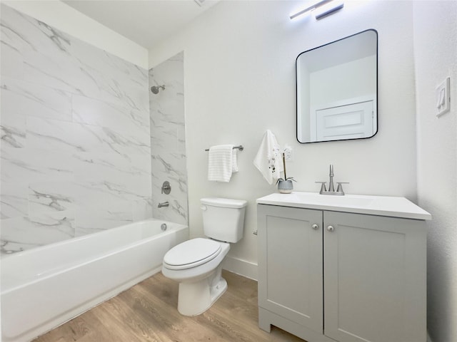3801 Carpenter Ave, Dallas, TX 75210 - full bath featuring wood finished floors, toilet, vanity, washtub / shower combination, and baseboards