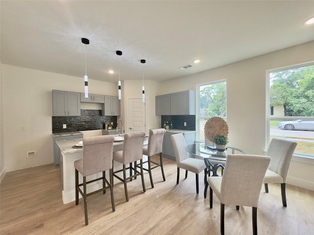 3801 Carpenter Ave, Dallas, TX 75210 - dining space with light wood finished floors, recessed lighting, and baseboards