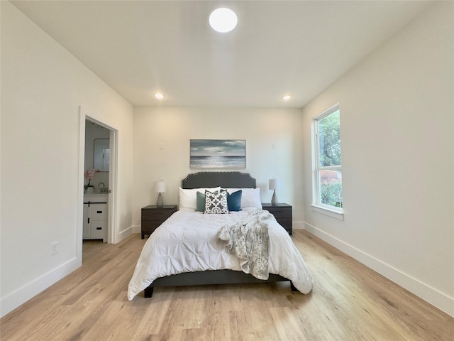 3801 Carpenter Ave, Dallas, TX 75210 - bedroom featuring light wood-style floors, baseboards, and recessed lighting