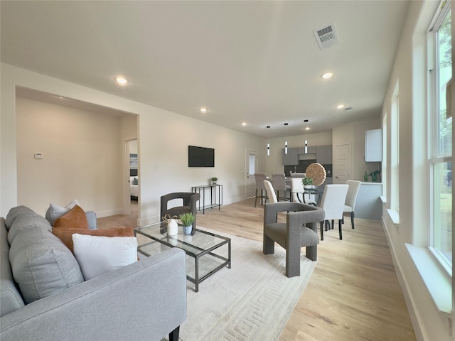 3801 Carpenter Ave, Dallas, TX 75210 - living room featuring recessed lighting, baseboards, and light wood-type flooring