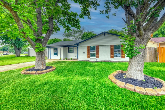 ranch-style home with brick siding and driveway
