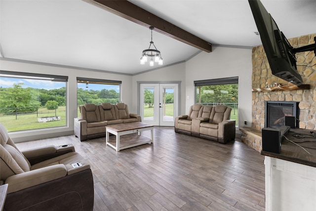 677 County Road 4027, Savoy, TX 75479 - living area with a fireplace, french doors, wood finished floors, and a chandelier