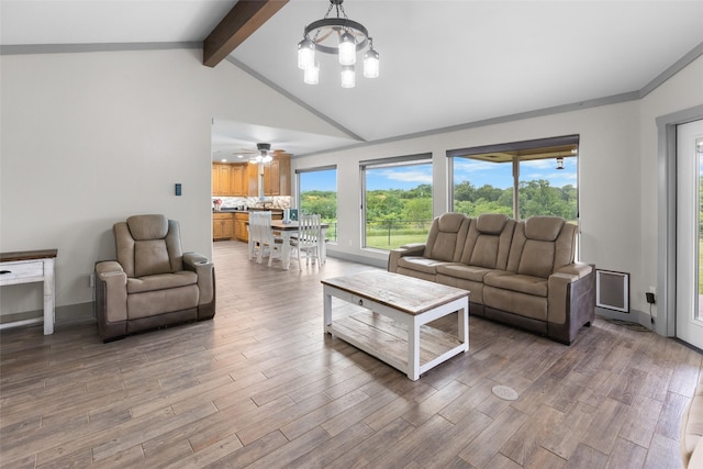 677 County Road 4027, Savoy, TX 75479 - living area featuring a chandelier, light wood-type flooring, baseboards, and a ceiling fan
