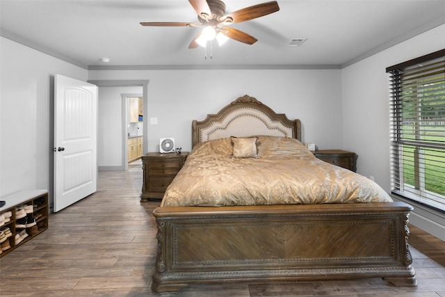677 County Road 4027, Savoy, TX 75479 - bedroom featuring multiple windows, wood finished floors, and ceiling fan