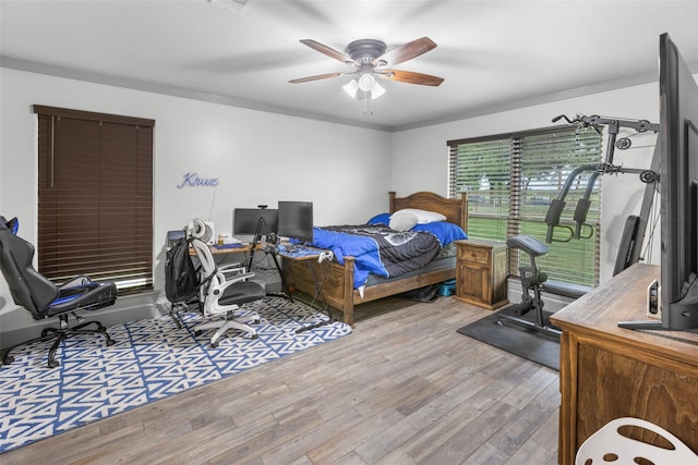 677 County Road 4027, Savoy, TX 75479 - bedroom featuring wood finished floors, an office area, and ceiling fan