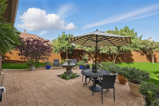 3002 Spring Hill Ln, Highland Village, TX 75077 - fenced backyard featuring a patio and outdoor dining area
