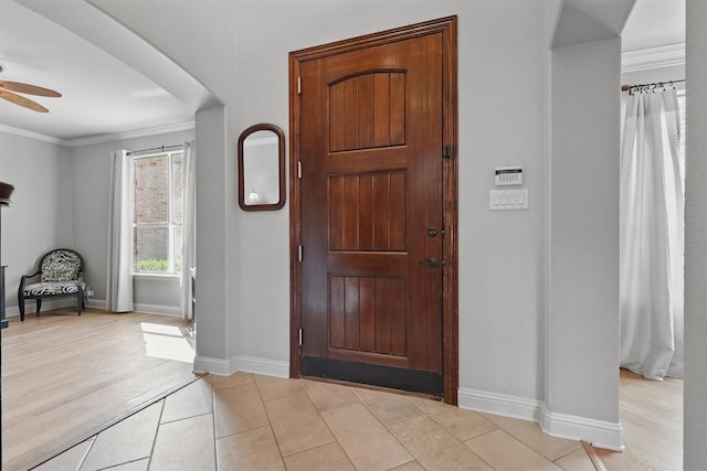 3002 Spring Hill Ln, Highland Village, TX 75077 - entryway featuring ceiling fan, crown molding, baseboards, and light tile patterned floors
