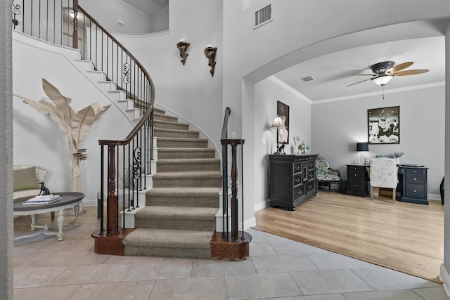 3002 Spring Hill Ln, Highland Village, TX 75077 - stairs with crown molding, arched walkways, a ceiling fan, and baseboards