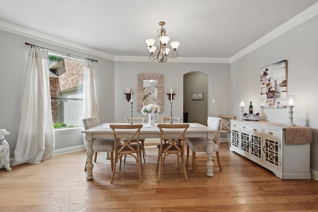 3002 Spring Hill Ln, Highland Village, TX 75077 - dining area with arched walkways, crown molding, light wood finished floors, a chandelier, and baseboards