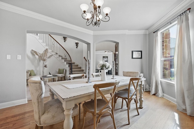 3002 Spring Hill Ln, Highland Village, TX 75077 - dining space with arched walkways, stairs, baseboards, light wood-style flooring, and ornamental molding