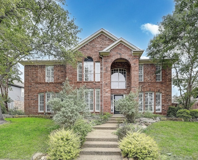 4205 English Ivy Dr, Mckinney, TX 75070 - view of front of house with brick siding and a front lawn