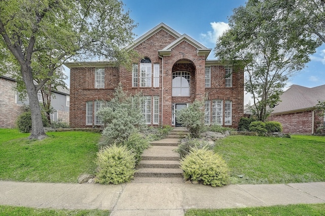 4205 English Ivy Dr, Mckinney, TX 75070 - view of front facade with brick siding and a front lawn