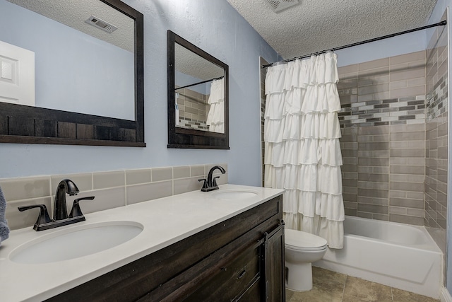 4205 English Ivy Dr, Mckinney, TX 75070 - bathroom featuring a textured ceiling, toilet, shower / bathtub combination with curtain, double vanity, and backsplash