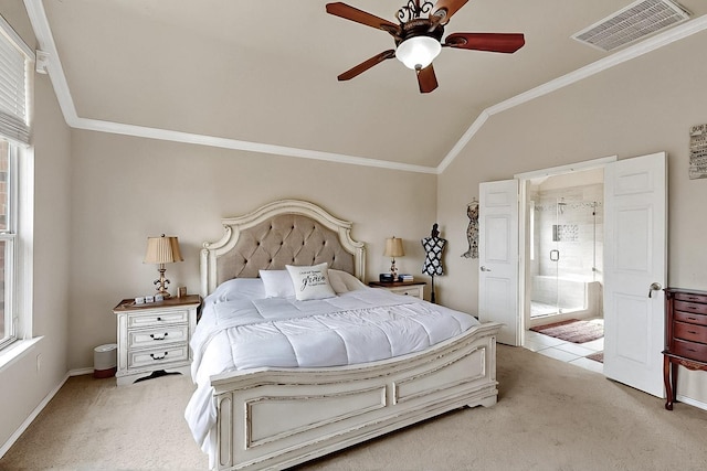 bedroom with light colored carpet, lofted ceiling, multiple windows, crown molding, and connected bathroom