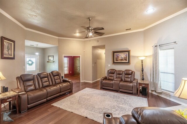 109 Fry Blvd, Tuscola, TX 79562 - living area featuring dark wood-style flooring, ceiling fan, baseboards, and crown molding