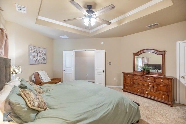 109 Fry Blvd, Tuscola, TX 79562 - bedroom featuring a tray ceiling, light carpet, ornamental molding, and a ceiling fan