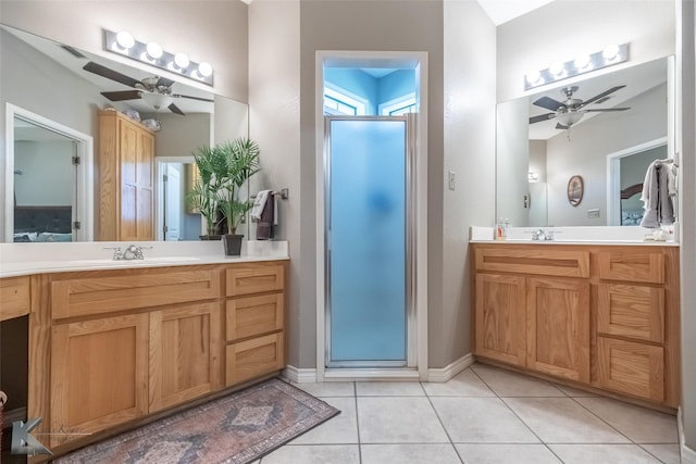 109 Fry Blvd, Tuscola, TX 79562 - bathroom with a ceiling fan, a shower stall, tile patterned floors, and two vanities