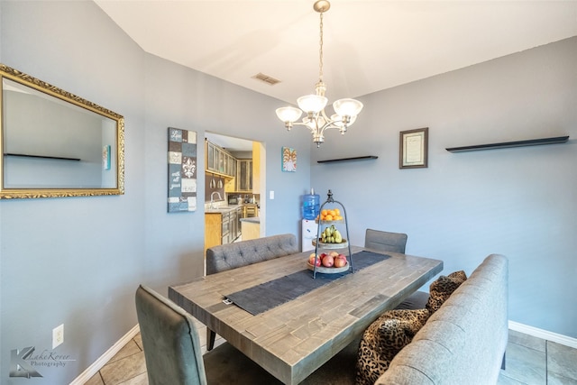 109 Fry Blvd, Tuscola, TX 79562 - dining room with a chandelier, light tile patterned floors, and baseboards