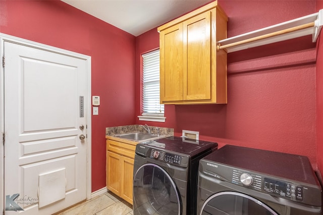 109 Fry Blvd, Tuscola, TX 79562 - washroom featuring washer and clothes dryer, cabinet space, light tile patterned floors, and baseboards