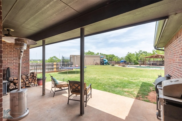 109 Fry Blvd, Tuscola, TX 79562 - view of patio with a trampoline and area for grilling