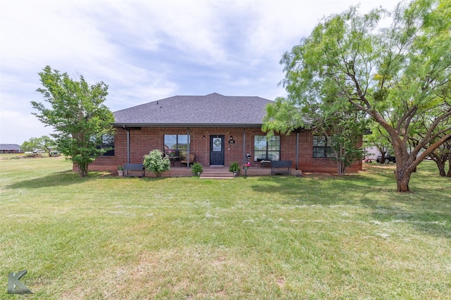 109 Fry Blvd, Tuscola, TX 79562 - view of front of property featuring a front yard, brick siding, and roof with shingles