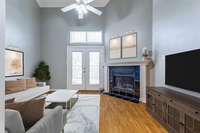 6000 Auburndale Ave Unit E, University Park, TX 75205 - living room featuring a high ceiling, ceiling fan, wood finished floors, french doors, and ornamental molding