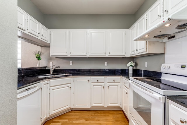 6000 Auburndale Ave Unit E, University Park, TX 75205 - kitchen with white appliances, under cabinet range hood, a sink, white cabinetry, and light wood-type flooring