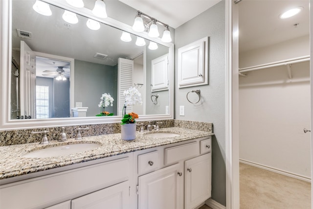 6000 Auburndale Ave Unit E, University Park, TX 75205 - full bath featuring double vanity, a spacious closet, a ceiling fan, and baseboards