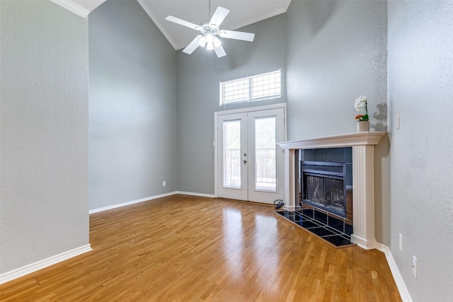 6000 Auburndale Ave Unit E, University Park, TX 75205 - unfurnished living room with ornamental molding, wood finished floors, ceiling fan, a tiled fireplace, and baseboards