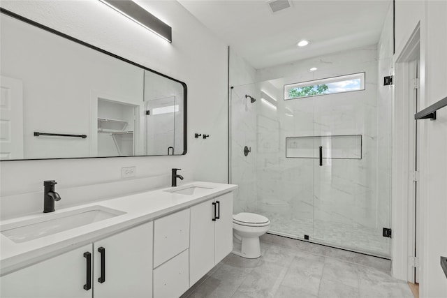2534 Pennsylvania Ave, Dallas, TX 75215 - full bathroom featuring a marble finish shower, toilet, and double vanity