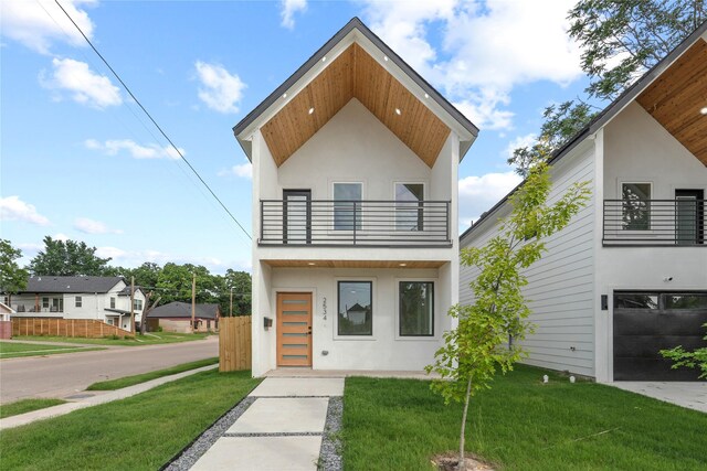 2534 Pennsylvania Ave, Dallas, TX 75215 - modern home featuring a balcony and stucco siding
