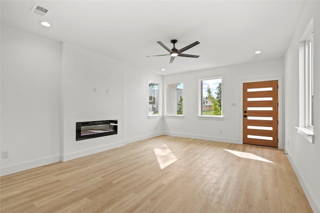2534 Pennsylvania Ave, Dallas, TX 75215 - unfurnished living room featuring light wood-type flooring, a ceiling fan, recessed lighting, and baseboards