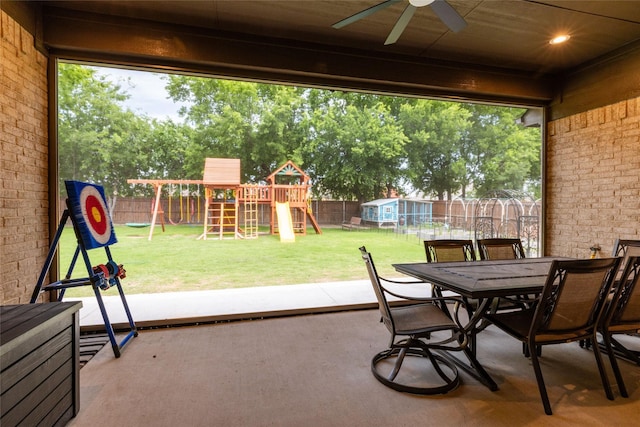 1100 Whisper Willows Dr, Fort Worth, TX 76052 - view of patio with a playground, ceiling fan, outdoor dining area, and an outdoor structure