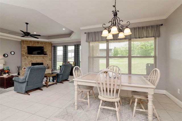 140 Pine Rd, Poolville, TX 76487 - dining space with a chandelier, light tile patterned flooring, crown molding, a raised ceiling, and a ceiling fan