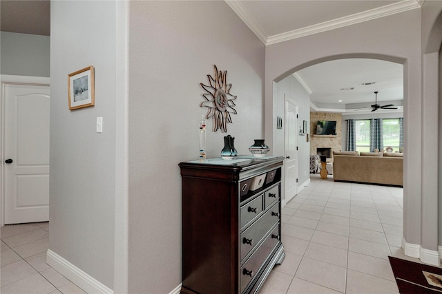 140 Pine Rd, Poolville, TX 76487 - corridor featuring arched walkways, light tile patterned floors, crown molding, and baseboards