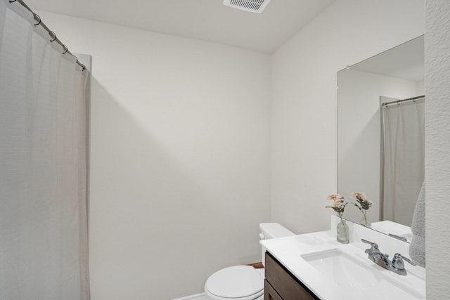 1403 Blossom Court Dr, Princeton, TX 75407 - bathroom featuring vanity, toilet, and baseboards