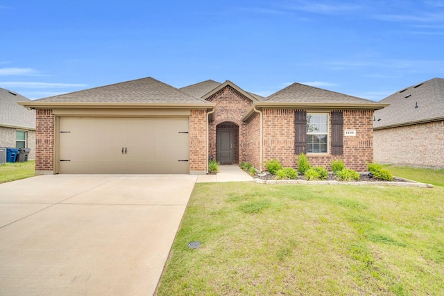 1403 Blossom Court Dr, Princeton, TX 75407 - view of front of house with a garage, brick siding, a front yard, driveway, and roof with shingles