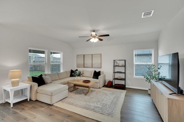 1403 Blossom Court Dr, Princeton, TX 75407 - living room featuring wood finished floors, a ceiling fan, plenty of natural light, and baseboards