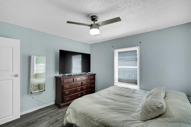 121 Chowning Dr, Desoto, TX 75115 - bedroom featuring dark wood-type flooring, a textured ceiling, baseboards, and ceiling fan