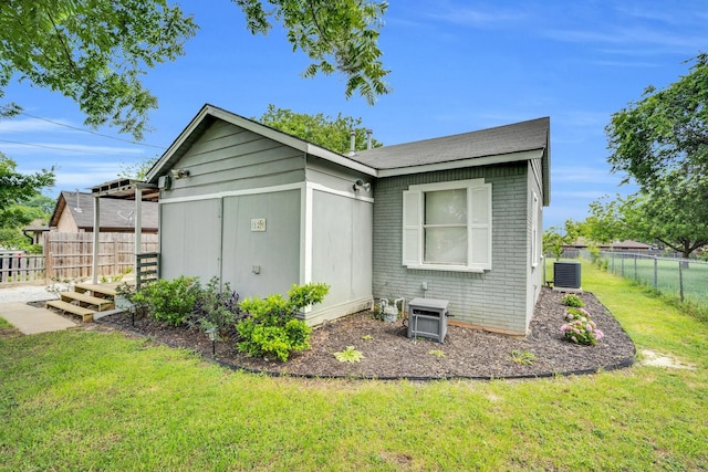 121 Chowning Dr, Desoto, TX 75115 - view of home's exterior with brick siding and central AC