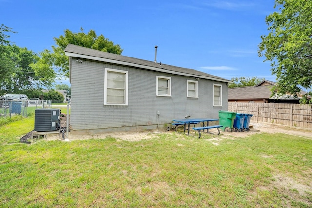 121 Chowning Dr, Desoto, TX 75115 - rear view of property with central AC and brick siding