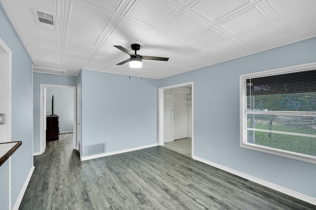 121 Chowning Dr, Desoto, TX 75115 - spare room featuring ceiling fan, wood finished floors, baseboards, an ornate ceiling, and attic access