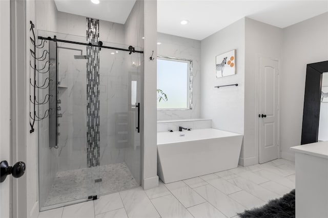203 Mcelroy St, Southmayd, TX 76273 - full bath with a freestanding tub, a stall shower, marble finish flooring, and recessed lighting