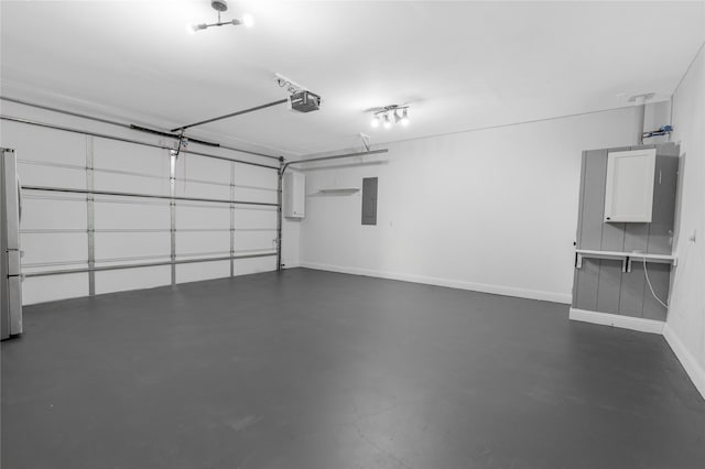 203 Mcelroy St, Southmayd, TX 76273 - garage with a garage door opener, electric panel, baseboards, and freestanding refrigerator