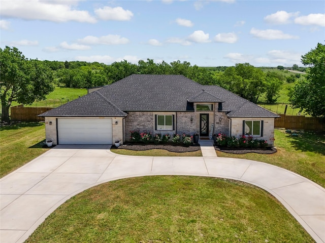203 Mcelroy St, Southmayd, TX 76273 - view of front of home with curved driveway, a shingled roof, a garage, and brick siding