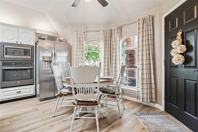 2630 Argyle Shore Dr, Rockwall, TX 75087 - dining area featuring lofted ceiling, light wood-style floors, a ceiling fan, and baseboards