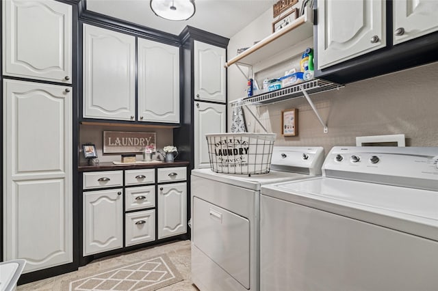 2630 Argyle Shore Dr, Rockwall, TX 75087 - laundry area featuring independent washer and dryer and cabinet space